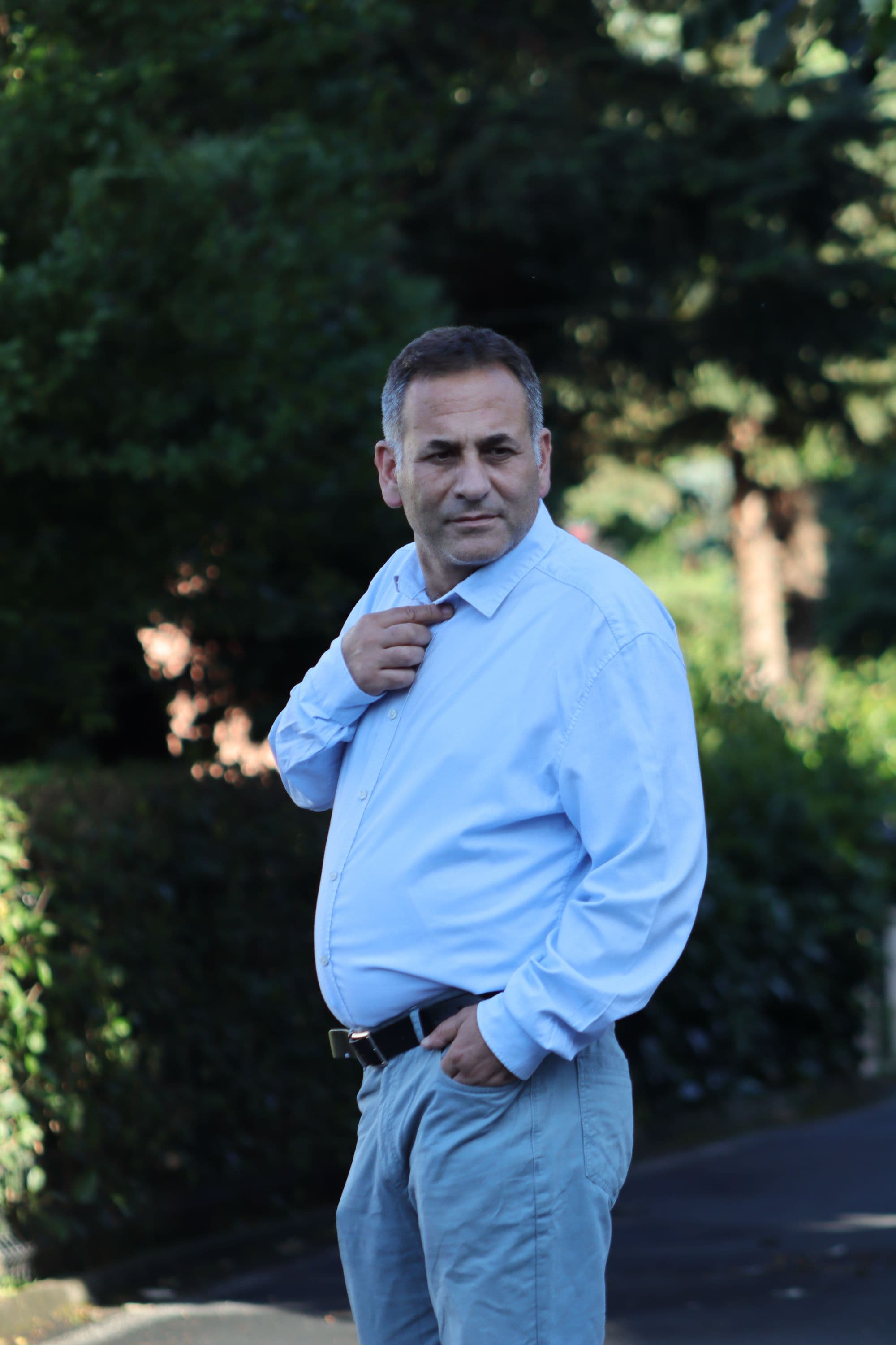 Confident man in his 40s in warm daylight